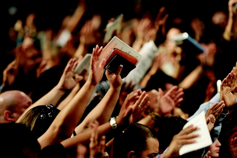 Photo of people worshiping in a church