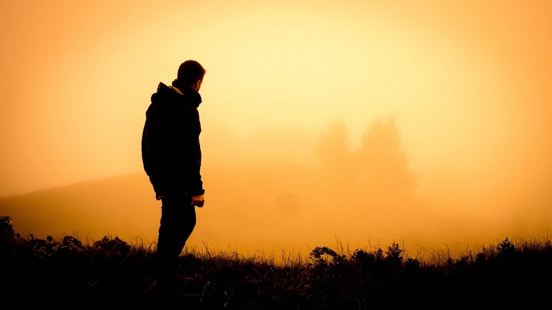 Man hiking at sunset