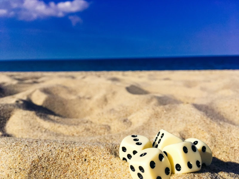 Photo of dice on a beach