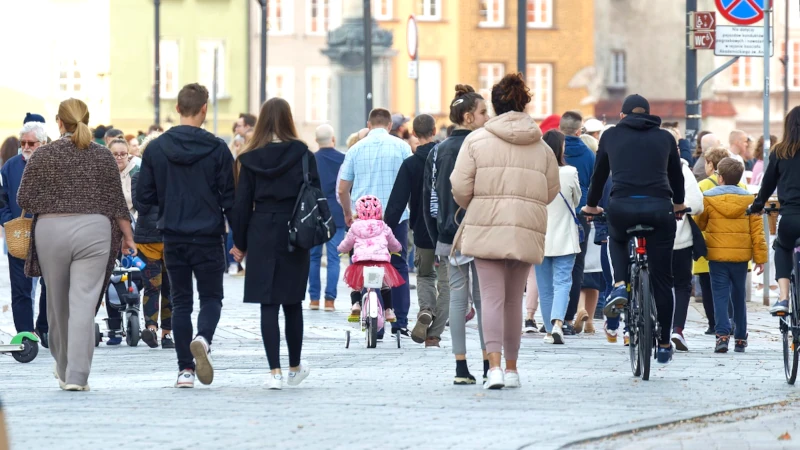 Photo of people walking in a city scene